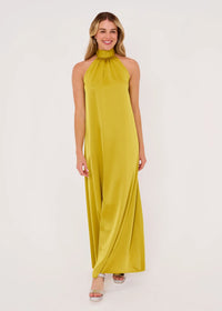 A model showcases a full-length gown in a rich golden olive satin, featuring a high neckline and a flowing silhouette.