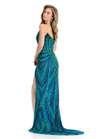 A model showcases a stunning strapless gown with a sweetheart neckline, adorned in a vibrant blue and jade floral sequin pattern.