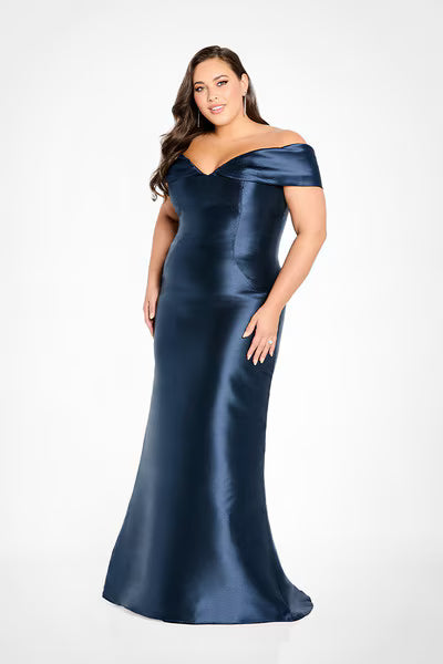 A model showcases a stunning off-the-shoulder navy mikado trumpet gown featuring a pleated V-neckline and covered button details.