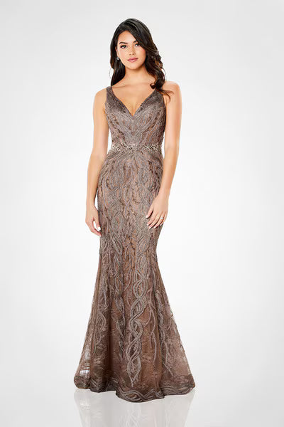 A model showcases a stunning sleeveless metallic ribbon gown in a mocha hue, featuring intricate lace detailing and a flattering V-neckline.