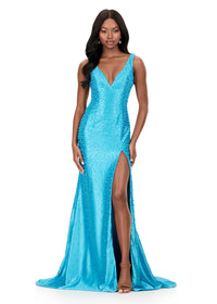 A stunning model showcases a turquoise ASHLEYlauren beaded evening gown with a deep V-neckline and a thigh-high slit, perfect for formal events like galas, proms, or black tie weddings.