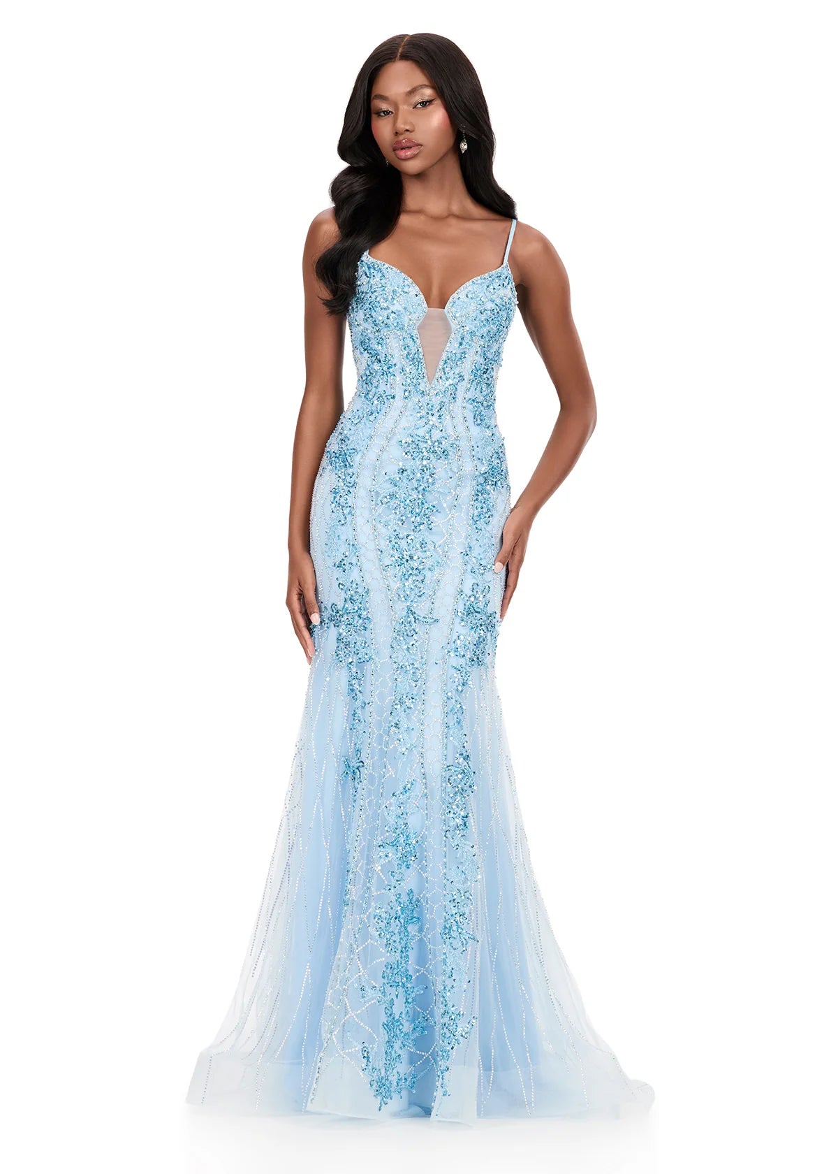 A model showcases a stunning ice blue gown with intricate embellishments and a fitted silhouette, perfect for a gala or black tie wedding. This elegant dress is conveniently available near Apex, Cary, and Raleigh for special occasions.