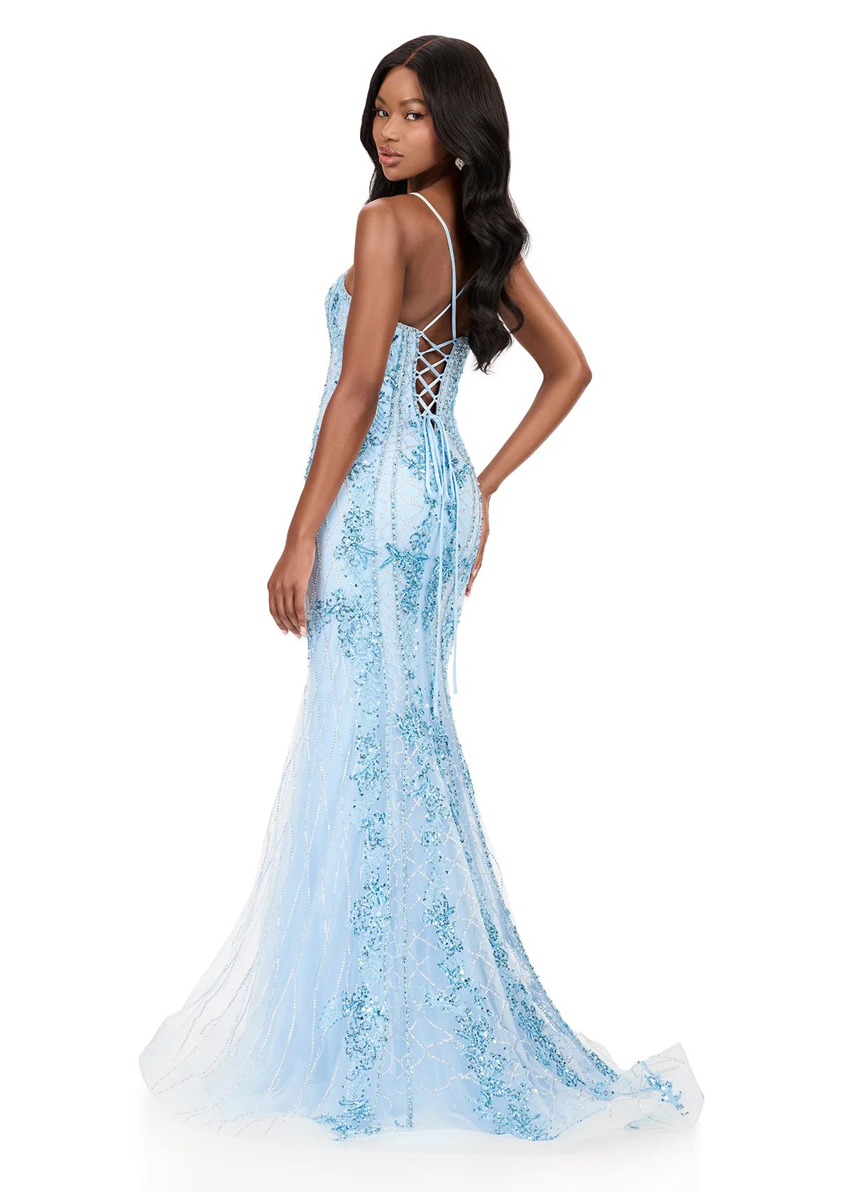 A model showcases the stunning ASHLEYlauren 12221 gown in ice blue, featuring intricate embellishments and a lace-up back design.