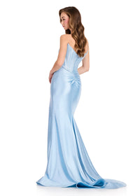 A model showcases a stunning light blue strapless gown with a fitted silhouette and elegant draping at the back, perfect for formal occasions like galas, proms, or black tie weddings.
