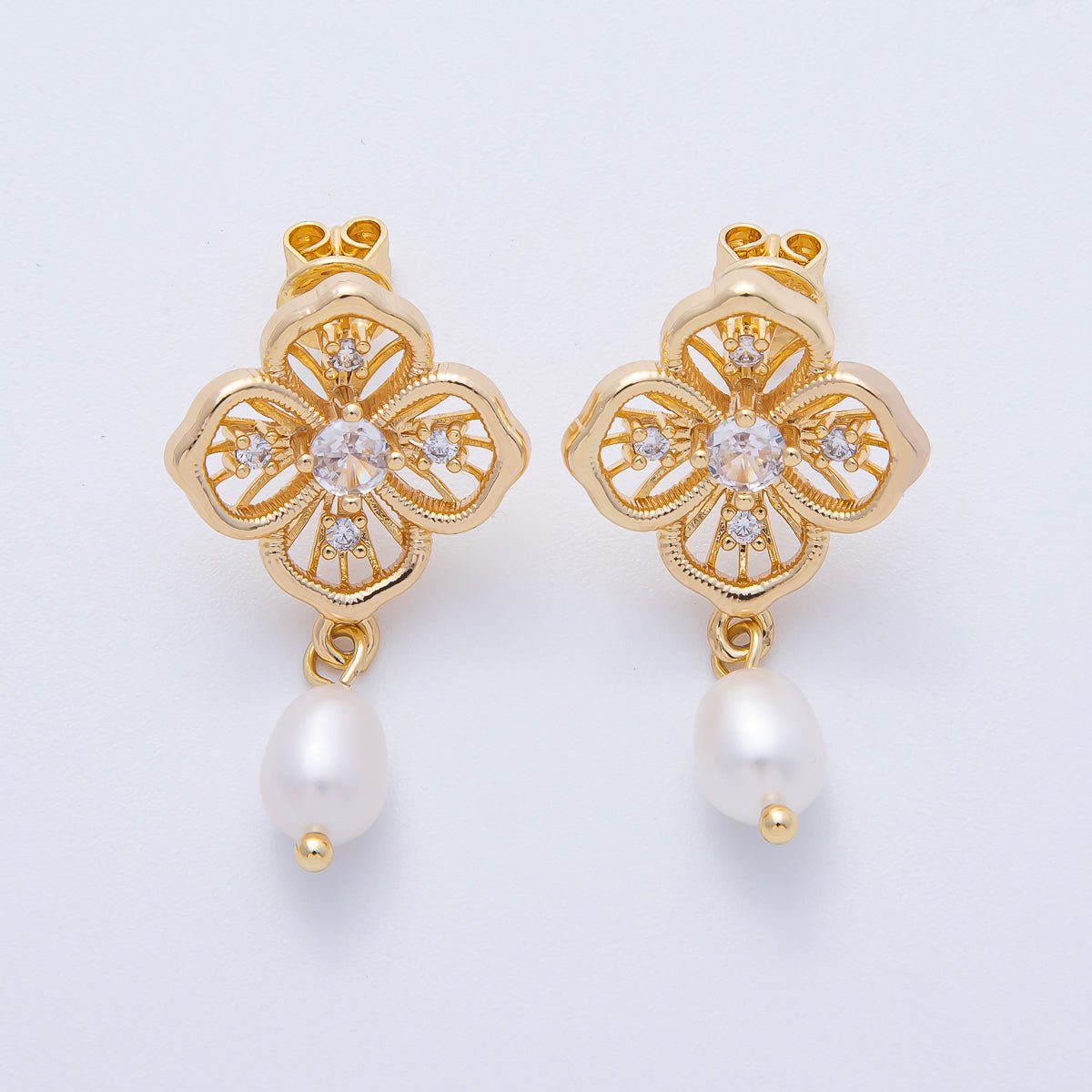 Elegant gold flower filigree earrings feature intricate detailing and a pearl drop, making them perfect for special occasions like weddings, proms, or galas. Ideal for adding a touch of sophistication to any outfit.