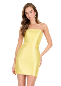 A model showcases a vibrant yellow strapless cocktail dress with a fitted silhouette and a satin finish.