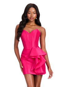 A model showcases a stunning fuchsia cocktail dress featuring a sweetheart neckline and a dramatic side ruffle. Perfect for special occasions like prom, homecoming, or a gala, this dress is conveniently located near Apex, Cary, and Raleigh.