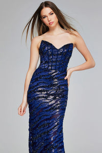 A model showcases a stunning navy strapless gown adorned with intricate beadwork and a mermaid silhouette, perfect for formal occasions like galas or black tie weddings. This dress is conveniently located near Apex, Cary, and Raleigh.