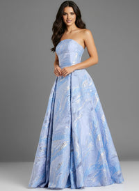 A model poses in a stunning strapless blue gown with intricate silver detailing, showcasing a flowing A-line silhouette.