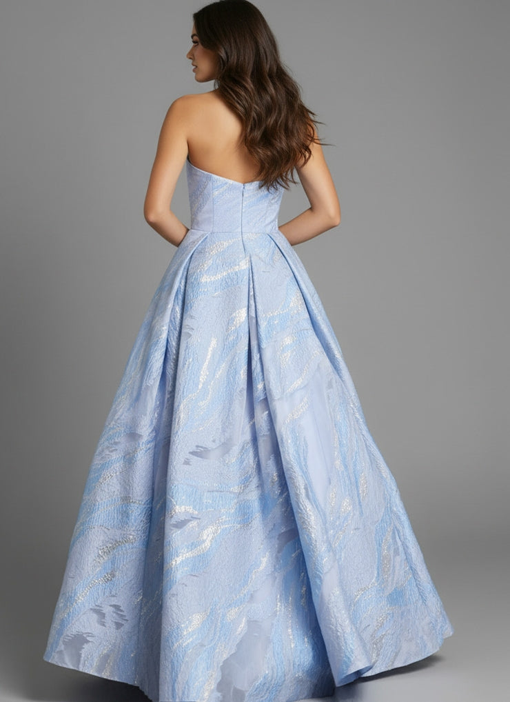 A model showcases a stunning blue gown with a structured bodice and a full, flowing skirt, perfect for elegant occasions like proms or gala events.