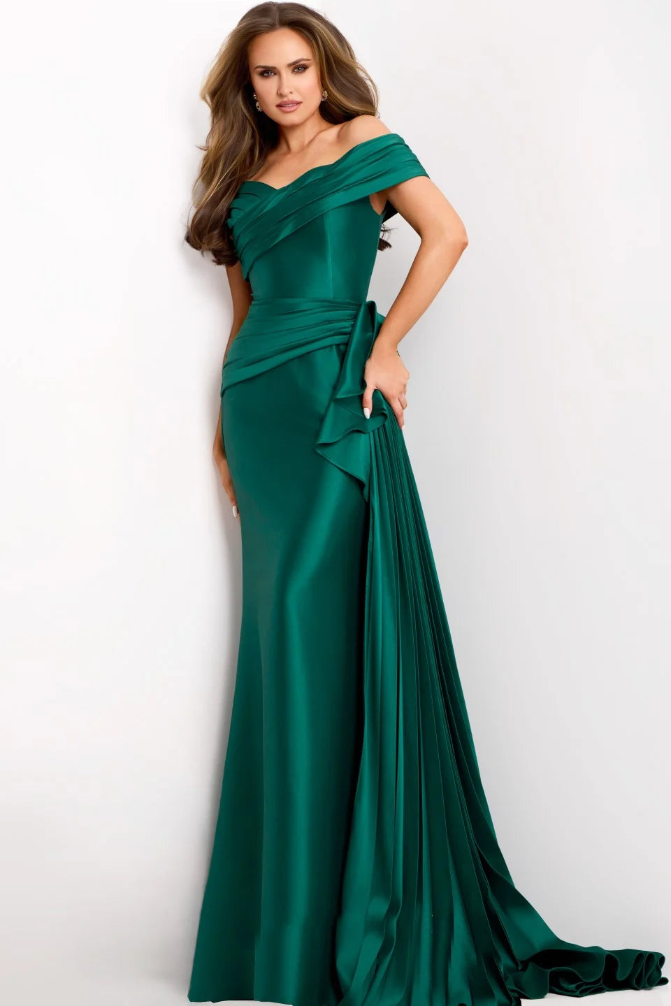 A stunning emerald green floor-length gown featuring an off-the-shoulder sweetheart neckline and soft pleats cascading down one side.