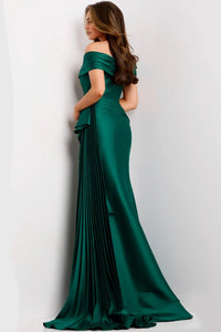 A model showcases an elegant emerald green floor-length gown with an off-the-shoulder sweetheart neckline and soft pleats cascading down one side.
