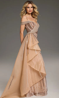 A stunning champagne gown featuring intricate beadwork and layered ruffles, perfect for formal occasions such as a gala or a black tie wedding. This elegant dress is conveniently available near Apex, Cary, and Raleigh.
