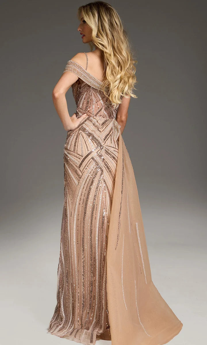 A glamorous champagne gown with intricate beadwork and an elegant back design features a flowing train. Perfect for formal occasions like galas or black tie weddings, this stunning dress is conveniently located near Apex, Cary, and Raleigh.