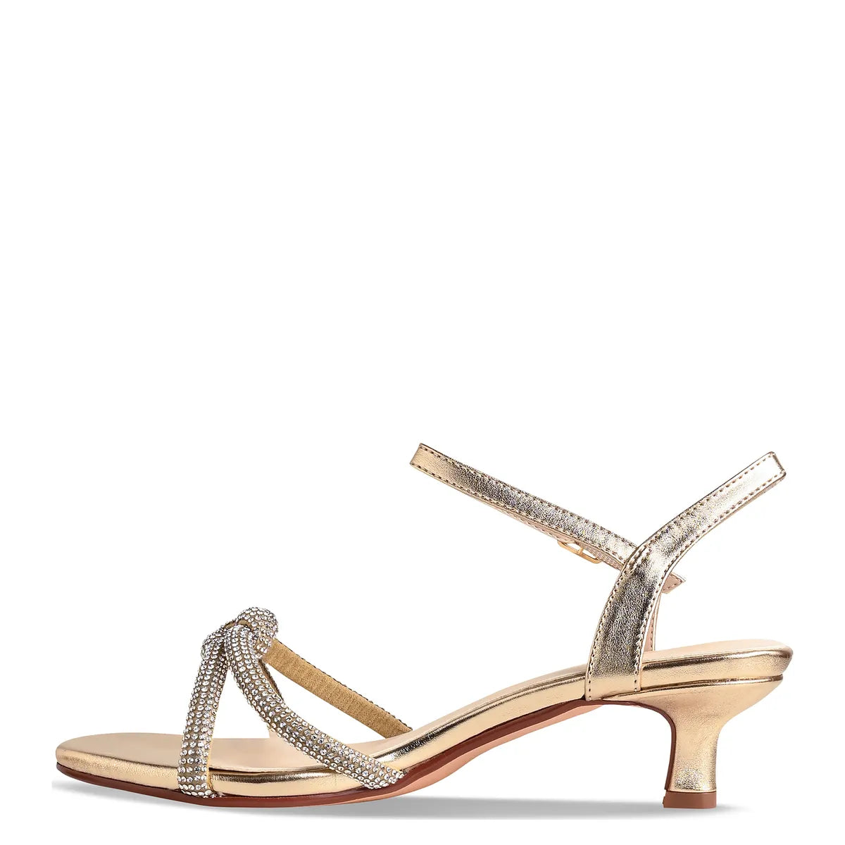 A stylish gold kitten heel sandal featuring a strappy design adorned with shimmering details. Perfect for special occasions such as weddings, proms, or galas, this shoe is available near Apex, Cary, and Raleigh for convenient shopping.