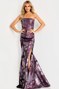 A stunning burgundy strapless gown featuring a floral design and a high slit, perfect for formal occasions like galas or black tie weddings. This elegant dress is conveniently available near Apex, Cary, and Raleigh.