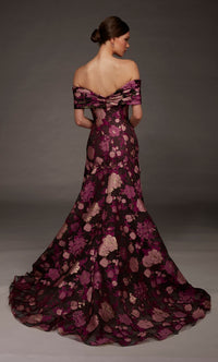 A model showcases an elegant off-the-shoulder gown featuring a floral pattern in deep burgundy and gold hues.