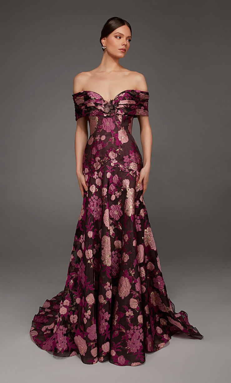 A model showcases an elegant off-the-shoulder gown adorned with vibrant floral patterns in shades of purple and pink.