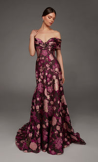 A model showcases an elegant off-the-shoulder gown adorned with vibrant floral patterns in shades of pink and gold.