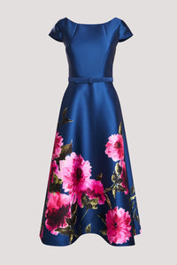 A stunning blue dress featuring a fitted bodice and short sleeves, adorned with vibrant pink floral patterns along the skirt.