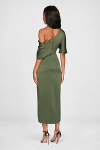 A model showcases a stylish olive green one-shoulder draped gown, featuring elegant satin fabric and a fitted silhouette.