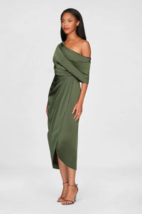 A model stands gracefully in a sleek, olive green one-shoulder draped gown, showcasing its elegant satin fabric and flattering silhouette.