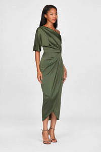 A model showcases a sophisticated olive green one-shoulder gown with draped detailing, perfect for formal events like galas or black tie weddings. This elegant dress is conveniently located near Apex, Cary, and Raleigh.