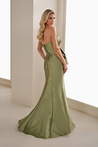 A stunning apple green trumpet gown features a fitted bodice and elegant train, perfect for special occasions like a mother of the bride or gala. This dress is conveniently located near Apex, Cary, and Raleigh for easy access.