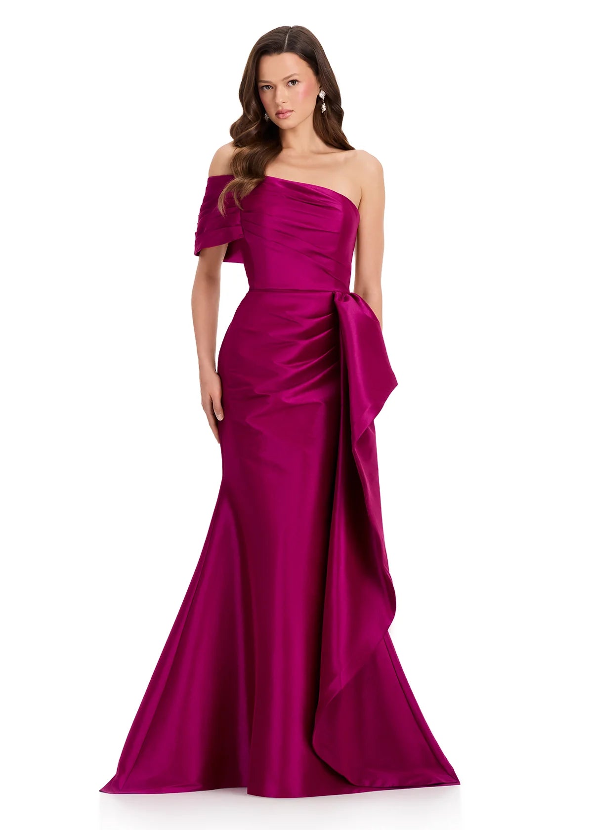 A model showcases a stunning one-shoulder berry gown, featuring elegant draping and a flowing silhouette. Perfect for occasions like prom, gala events, or black tie weddings, this dress is conveniently located near Apex, Cary, and Raleigh.
