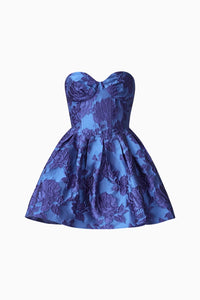 A vibrant blue mini dress featuring a strapless sweetheart neckline and a structured bustier bodice, adorned with floral patterns. Perfect for birthday parties or date nights, this stylish piece is available near Apex, Cary, and Raleigh.
