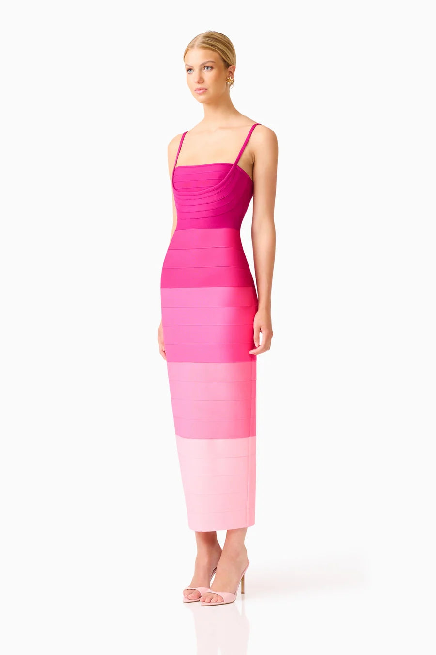 A model showcases a stunning pink ombre gown with a square neckline and fitted silhouette, perfect for elegant occasions like prom or a black tie wedding. This dress is conveniently located near Apex, Cary, and Raleigh.