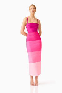 A model showcases a stunning pink ombre gown featuring a square neckline and fitted silhouette, perfect for occasions like prom, gala, or a black tie wedding. This elegant dress is conveniently available near Apex, Cary, and Raleigh.