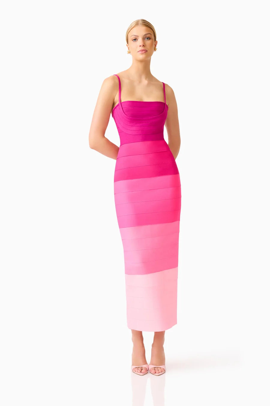 A model showcases a stunning pink ombre gown featuring a square neckline and fitted silhouette, perfect for occasions like prom, gala, or a black tie wedding. This elegant dress is conveniently available near Apex, Cary, and Raleigh.