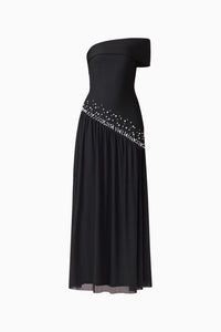 A sleek black off-shoulder gown features a fitted bodice and a flowing skirt adorned with delicate embellishments.