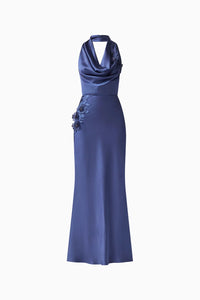 Elegant navy cowl neck gown featuring a fitted silhouette and floral embellishments on the side, perfect for special occasions like galas, weddings, or proms. Available conveniently near Apex, Cary, and Raleigh.