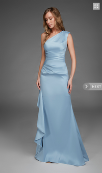 A model poses in an elegant one-shoulder gown in a soft glacier blue hue, showcasing a flattering silhouette with draped detailing.