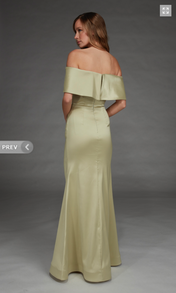 A model showcases a sophisticated off-the-shoulder gown in a soft honeydew color, featuring a fitted silhouette that flares at the hem.