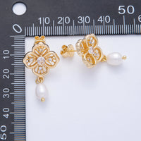 Elegant flower filigree earrings featuring a pearl drop and sparkling crystals, showcased against a ruler for size reference. Perfect for special occasions like weddings, proms, or galas, and available near Apex, Cary, and Raleigh.