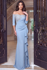 A stunning light blue gown featuring an off-the-shoulder design and elegant beaded detailing, complemented by cascading ruffles.