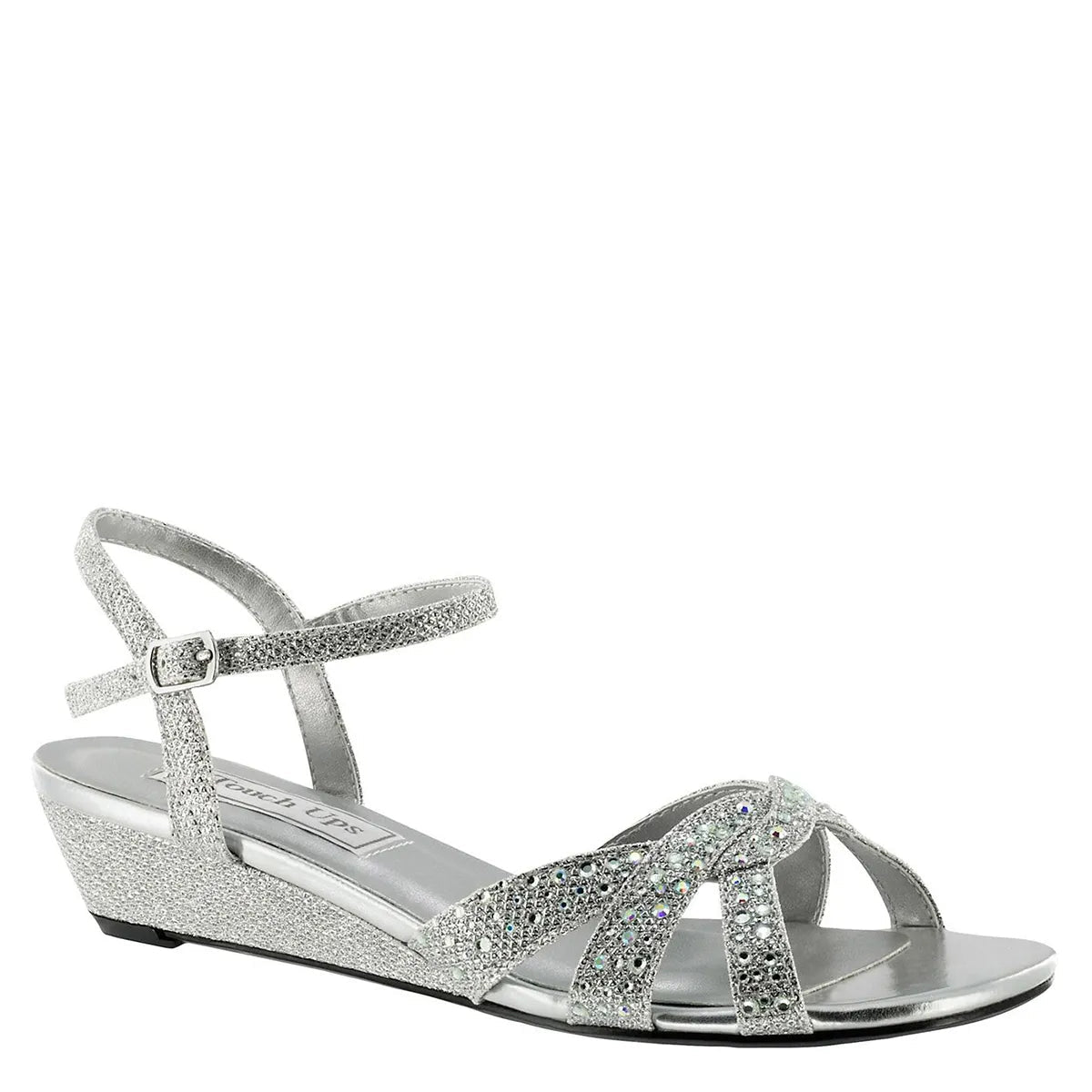 Stylish silver wedge sandals featuring a jeweled vamp and an adjustable ankle strap for support. Perfect for special occasions like weddings, proms, or galas, and conveniently located near Apex, Cary, and Raleigh.