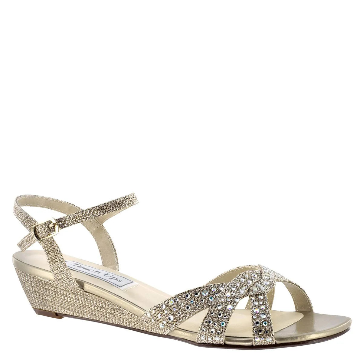 A stylish champagne wedge sandal featuring a jeweled vamp and ankle strap for added support. Perfect for special occasions like weddings, proms, or galas, these shoes are conveniently located near Apex, Cary, and Raleigh.