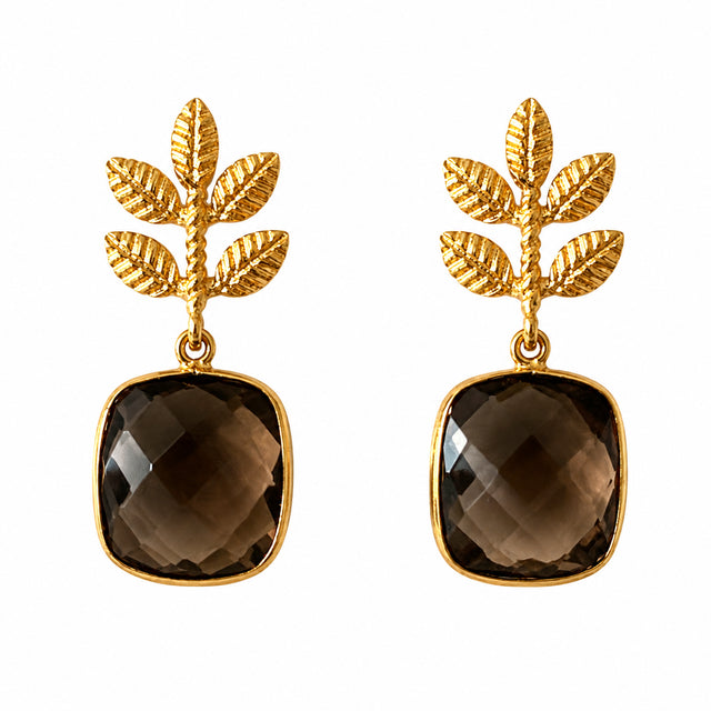 Elegant gold-tone earrings featuring a leaf design with a faceted smokey quartz stone. These versatile earrings are perfect for special occasions like weddings or galas, and are conveniently available near Apex, Cary, and Raleigh.